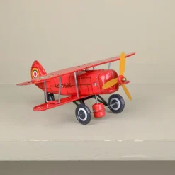 Avion biplan rouge mécanique